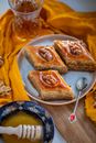 Three Chunks of Baklava on Plate with Tea Spoon