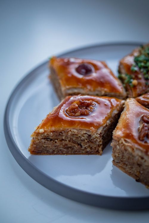 Free Close-up of delicious walnut baklava slices presented on a plate, showcasing rich textures. Stock Photo