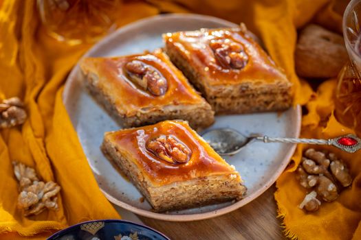 Savor the rich flavor of walnut baklava served on a decorative plate.