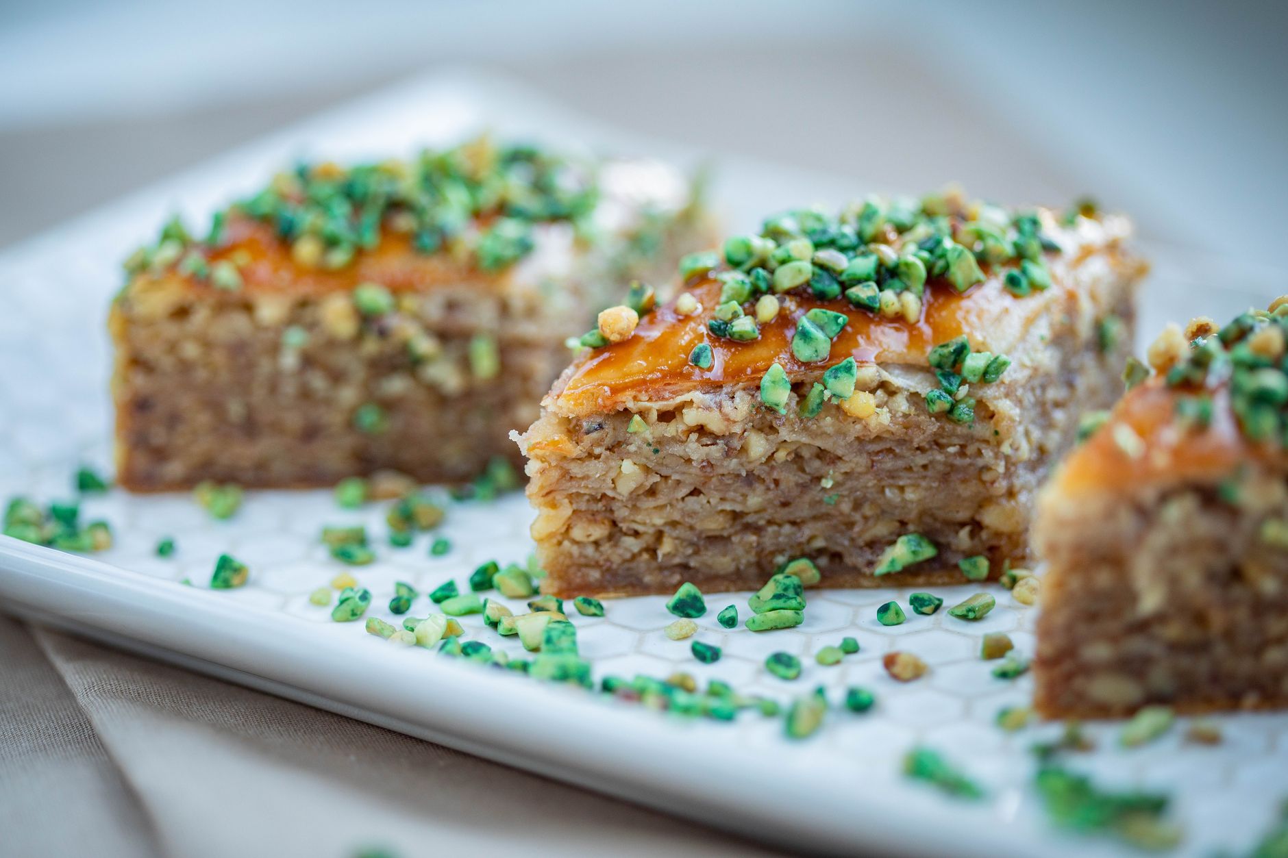 Freshly baked Pistachio Greek Honey Cake cut and ready to serve