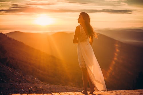 Free A Woman Posing During the Golden Hour Stock Photo