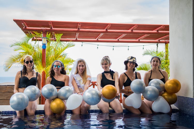 Woman Sitting In Swimming Pool For Bride Party