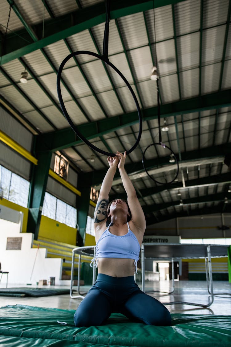 Gymnast Practicing With Rings