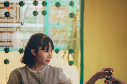Woman Wearing Gray and White Blouse
