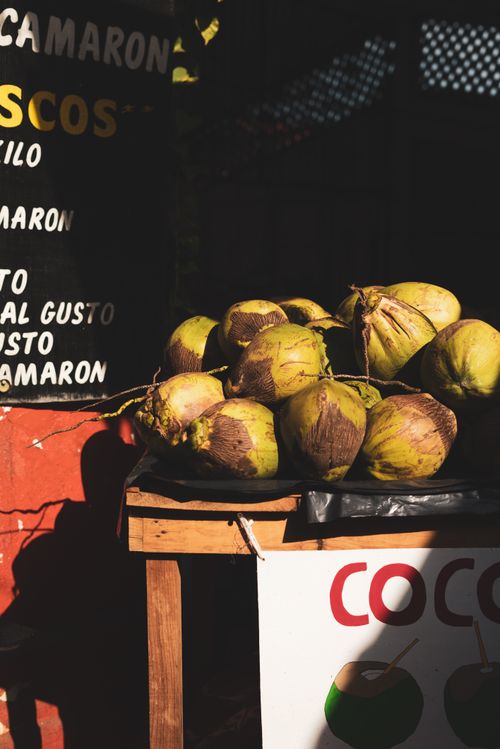 Free A vibrant display of green coconuts at a street market, ideal for tropical themes. Stock Photo
