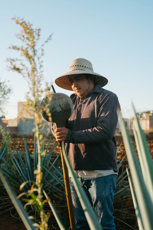 Man Holding a Shovel