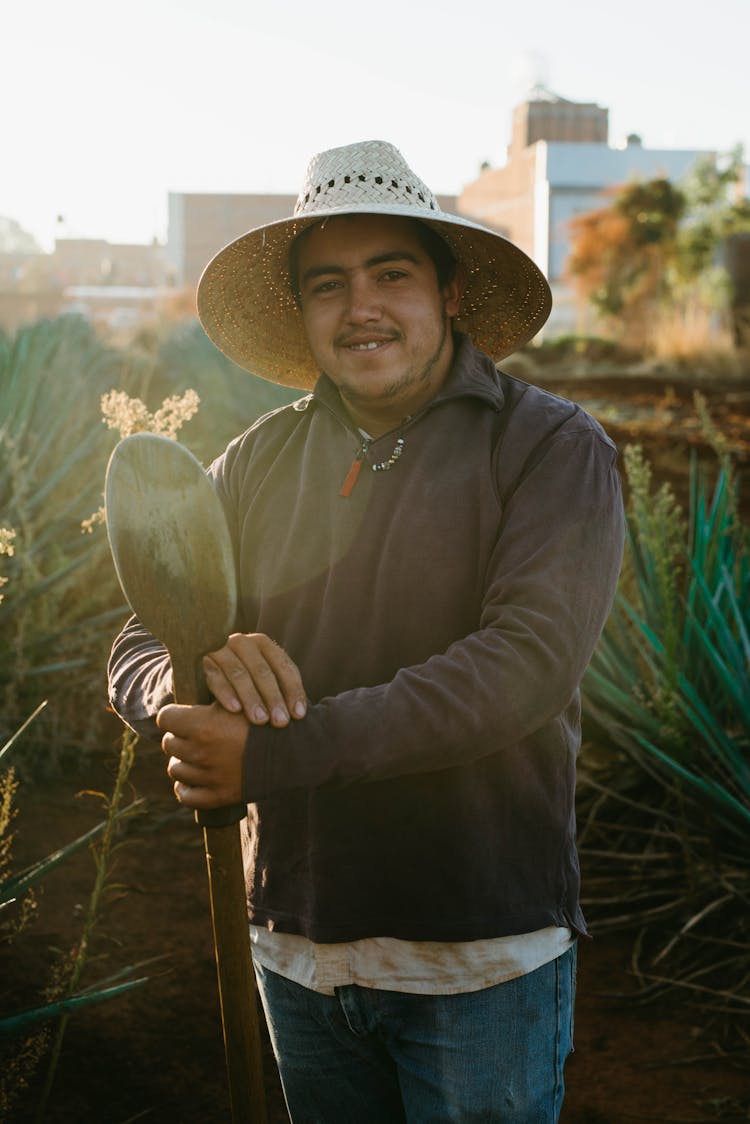 Man Holding A Shovel