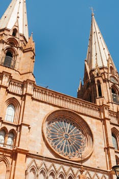Stunning view of the Guadalajara Cathedral showcasing its iconic spires and beautiful rose window.