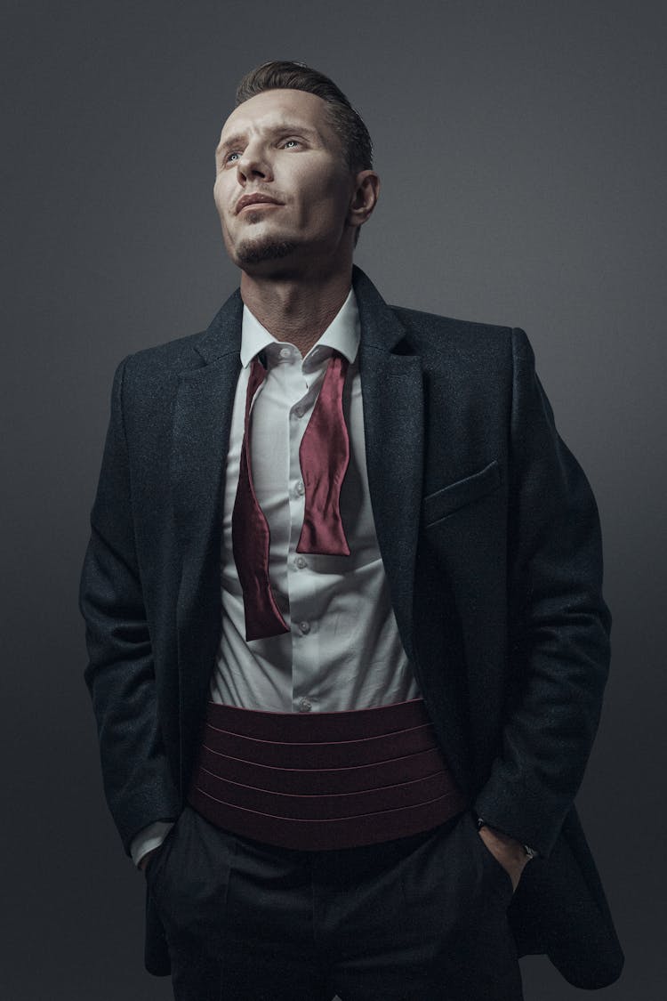 Handsome Clean Shaved Man In Suit With Untied Bow Tie