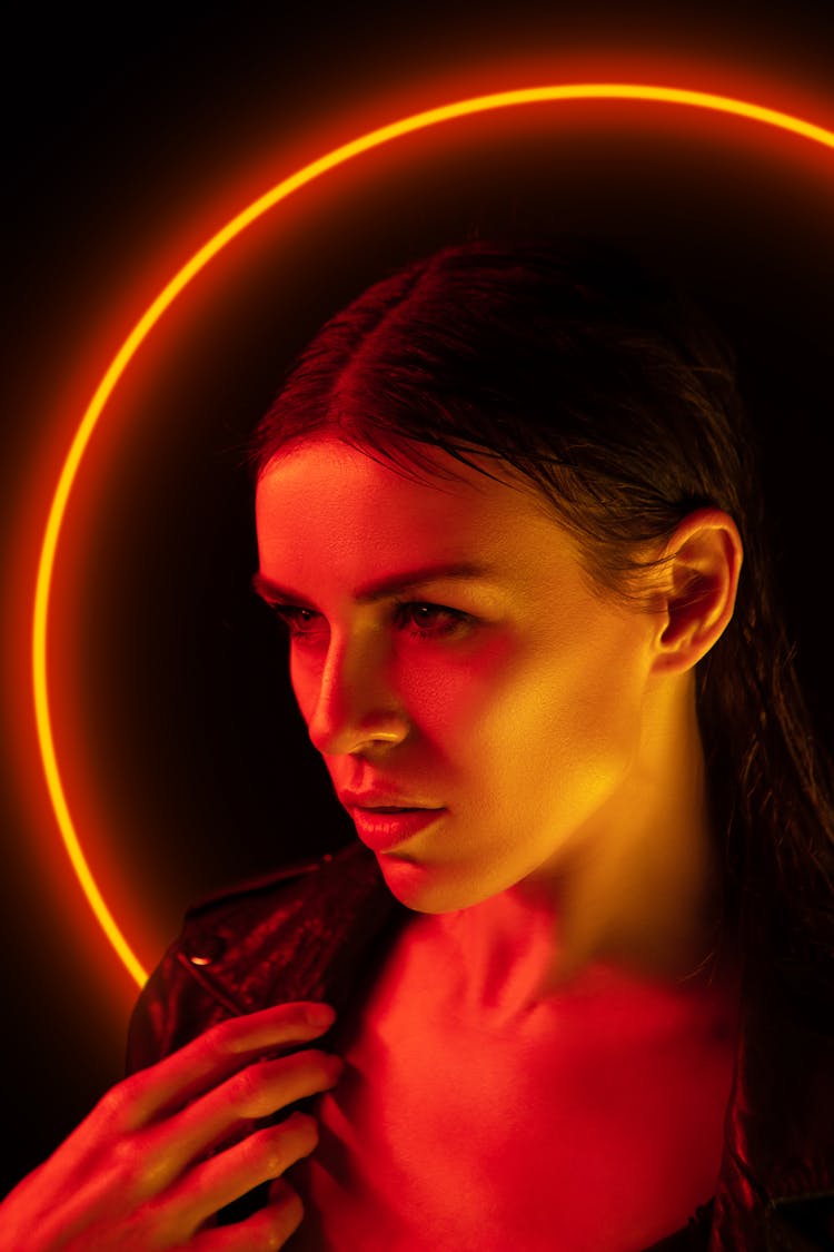 Portrait Of A Woman With Neon Light In Background