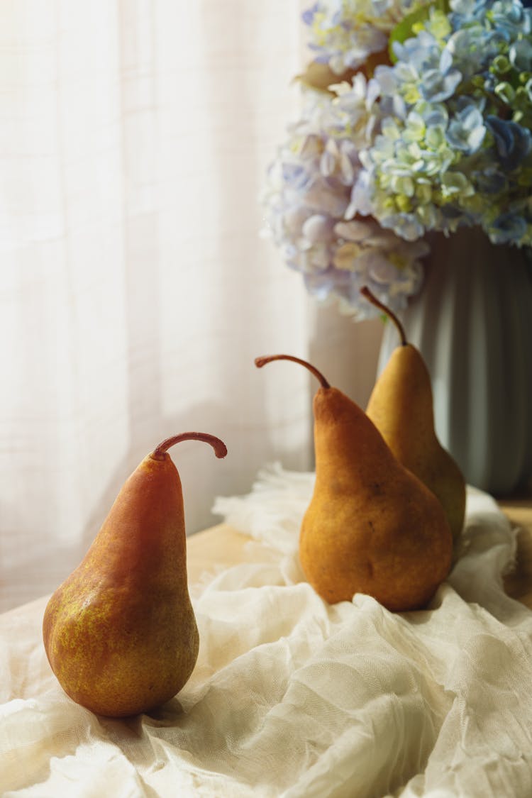 Pears On White Fabric On Table