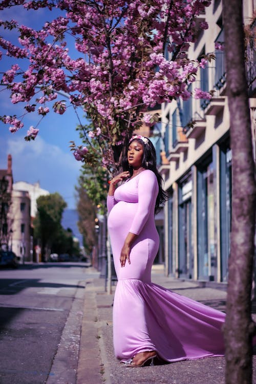 Pregnant Woman in Purple Dress