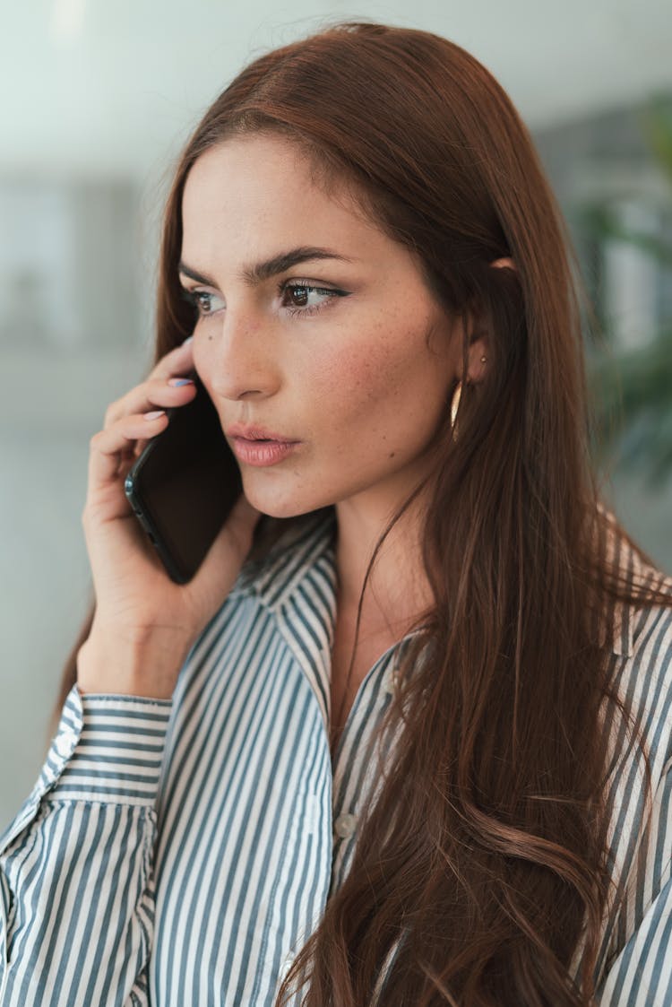 Brown Haired Woman Talking On Phone