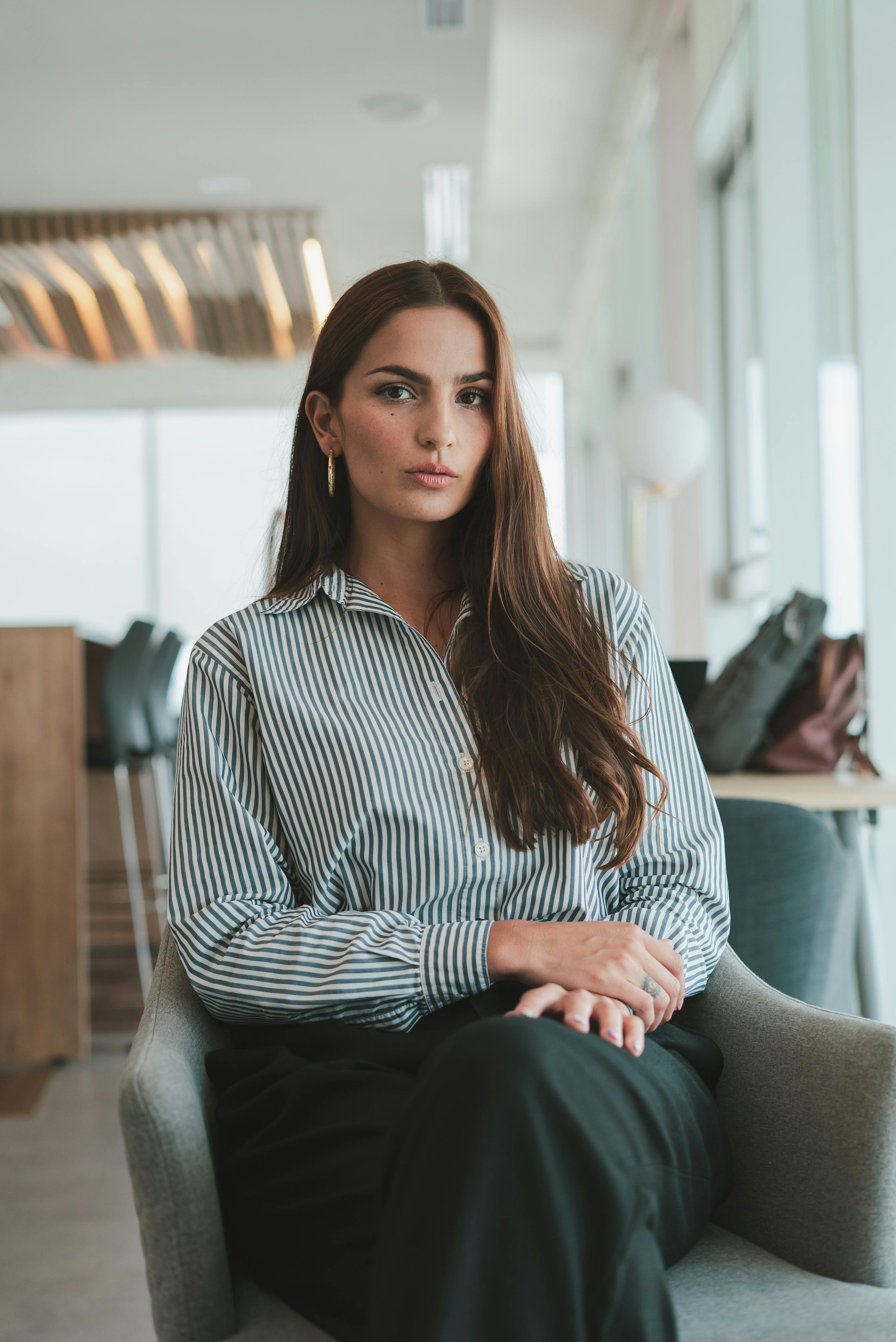 portrait of sitting brown haired businesswoman