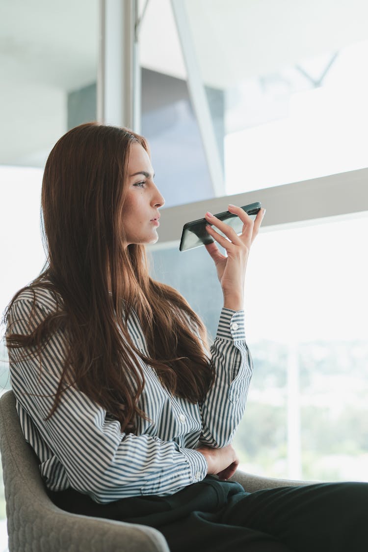 Sitting Businesswoman Talking On Phone