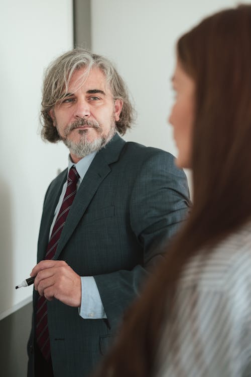 Businessman and Woman in Office