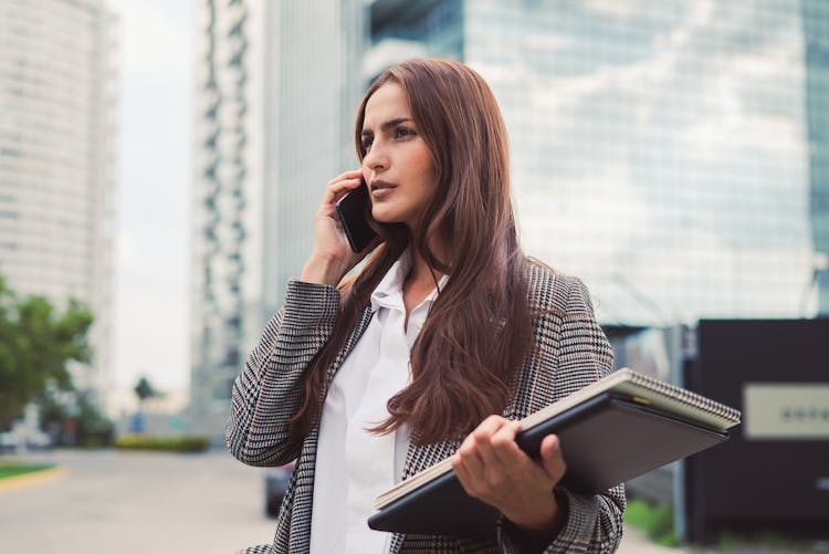 Portrait Of Woman In Coat Talking On Phone