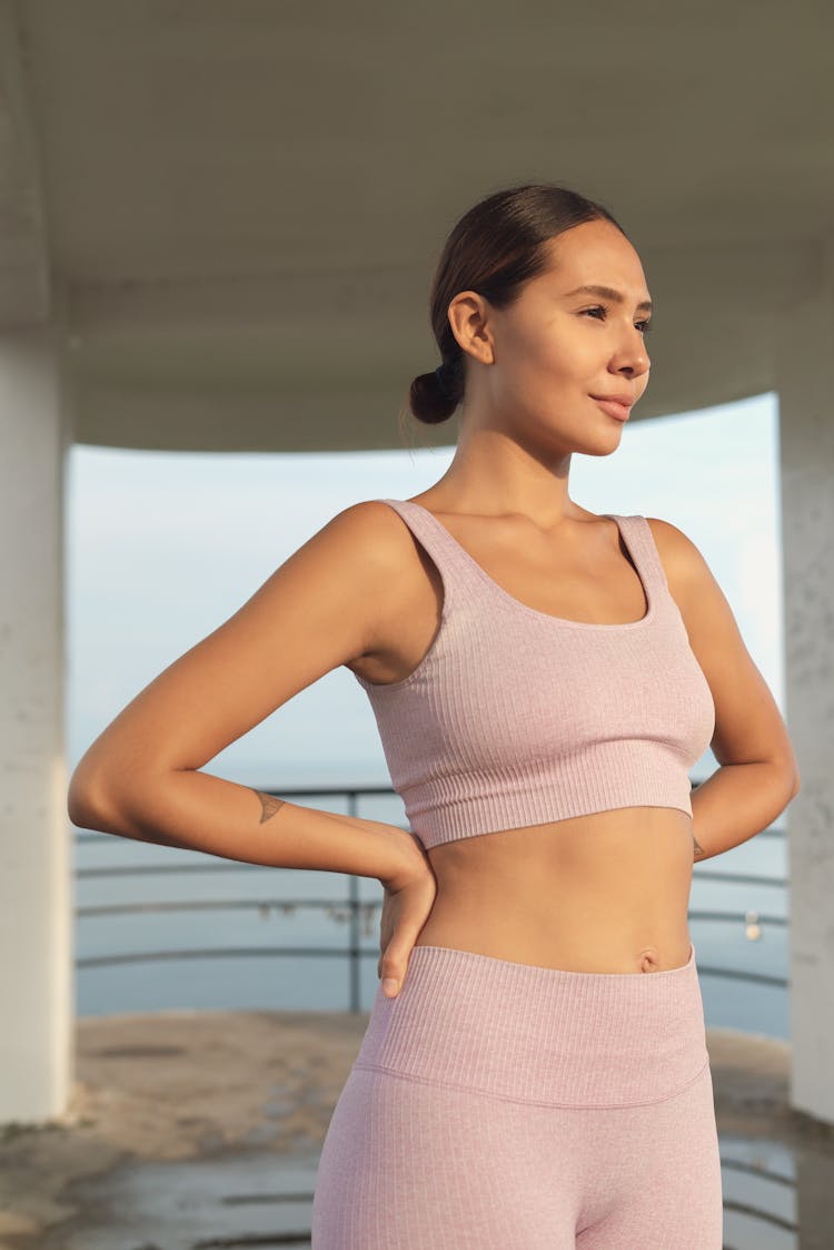 Fit Woman Standing With Hands On Hip