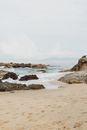 Rocks on Beach and in Sea