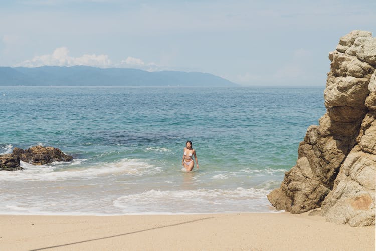 Woman In Bikini Walking In Water