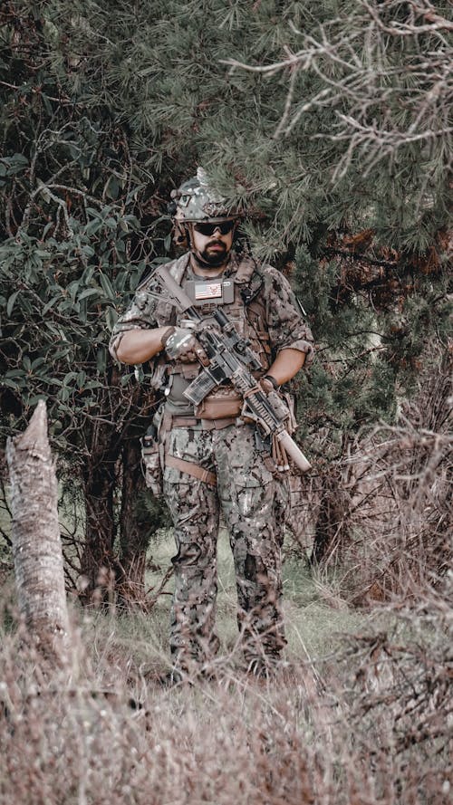 A Soldier Holding a Rifle 