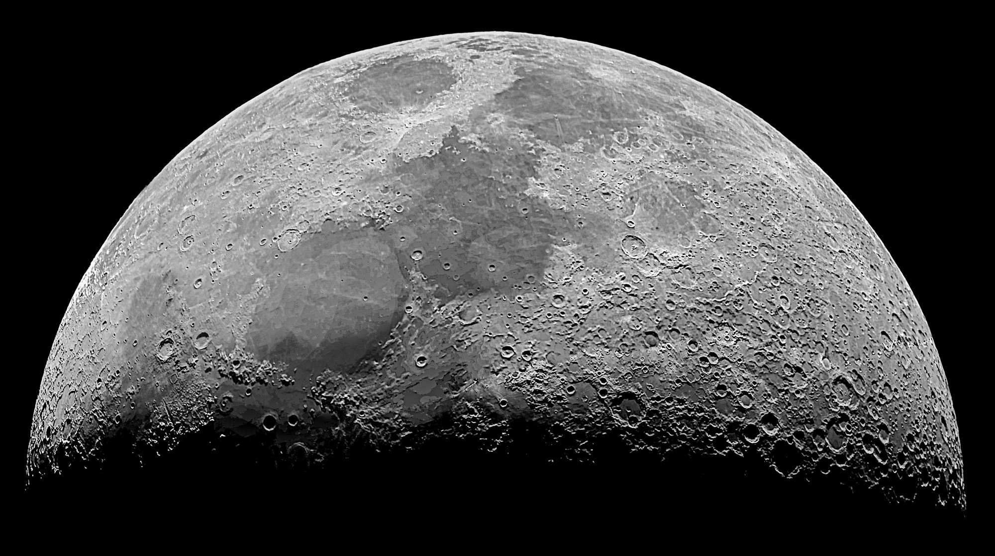 High-resolution monochrome image of the moon's surface showcasing craters and details.