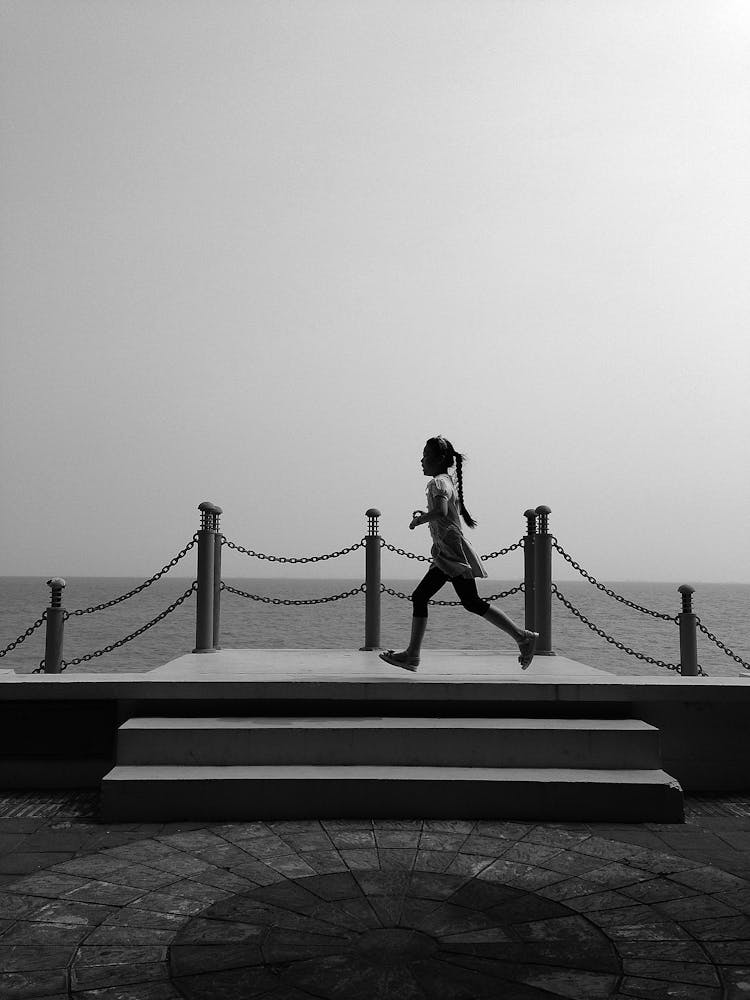 A Girl Running On A Stage