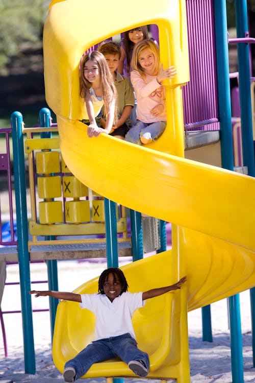 Children on Yellow Slide