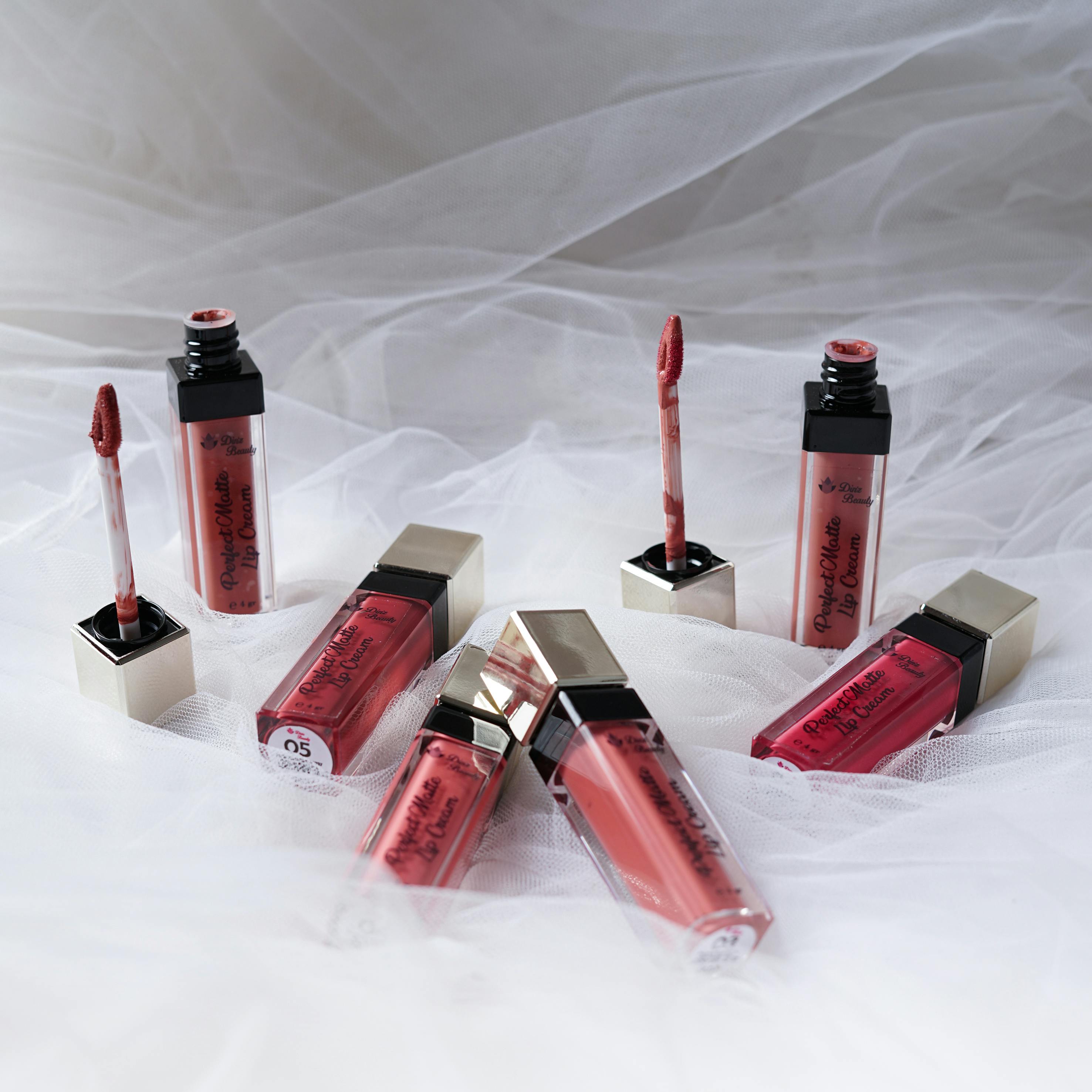 Lipsticks on White Bedding · Free Stock Photo