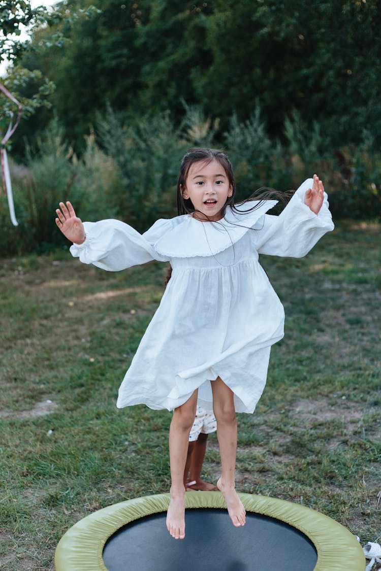 Girl Jumping On Trampoline