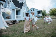 People Playing Sack Race on Green Grass