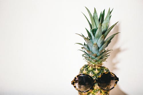 Close-Up Photography of Eyeglasses on Pineapple
