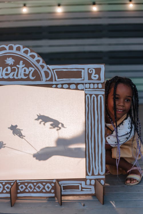 Free Girl Performing Shadow Theatre Stock Photo