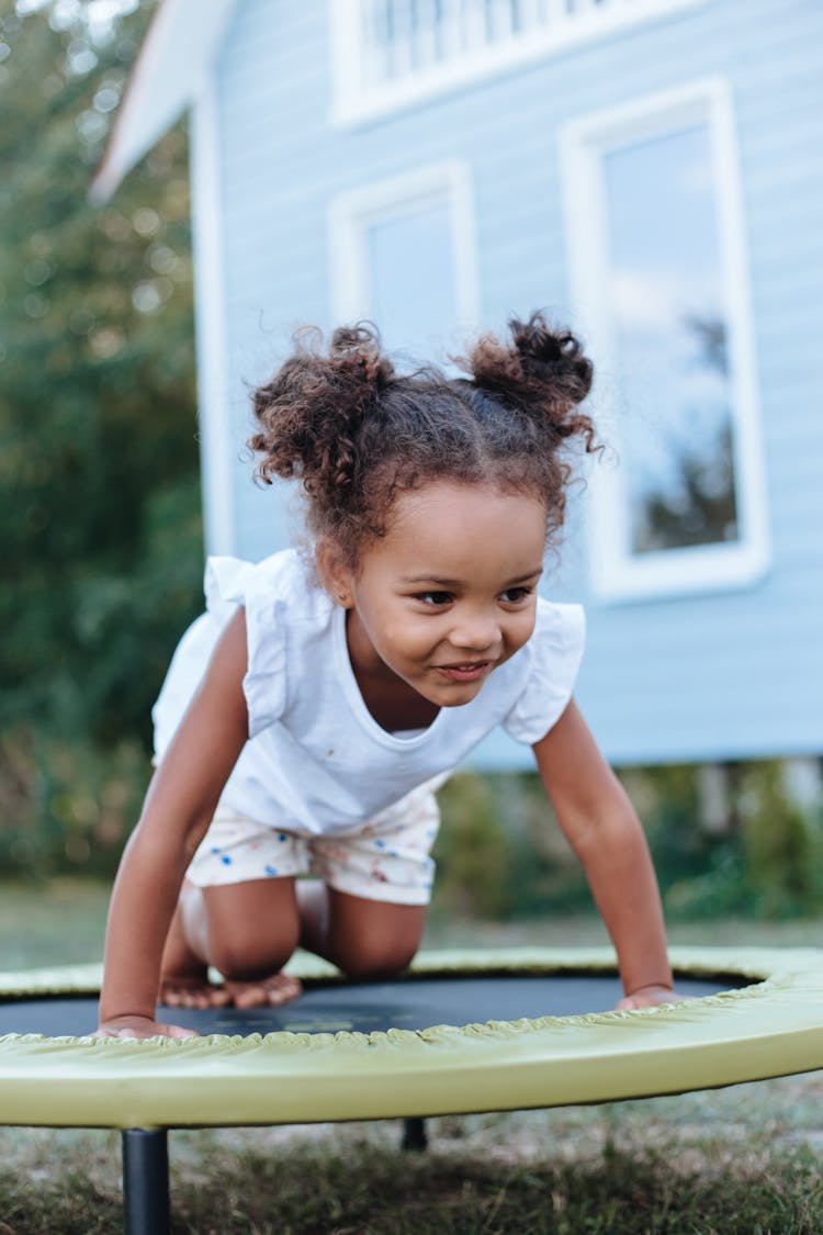 A Cute Girl On A Trampoline