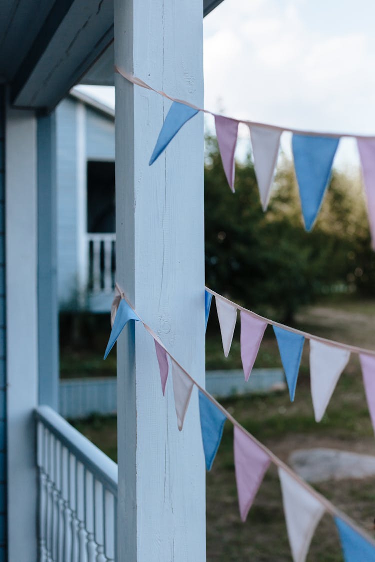 Pastel Colored Pennant Hanging On Porch