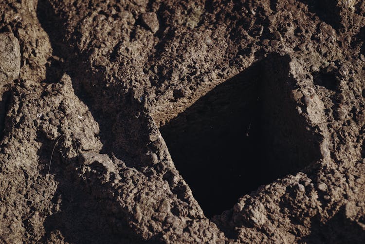 Rectangular Hole Dug In Soil