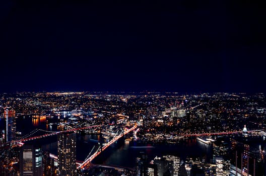 A mesmerizing aerial view of New York City skyline illuminated at night.
