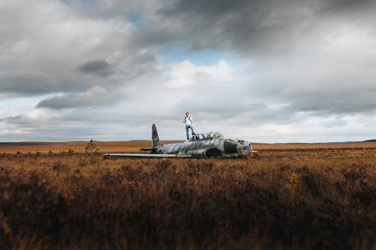 Man On Airplane Wreckage