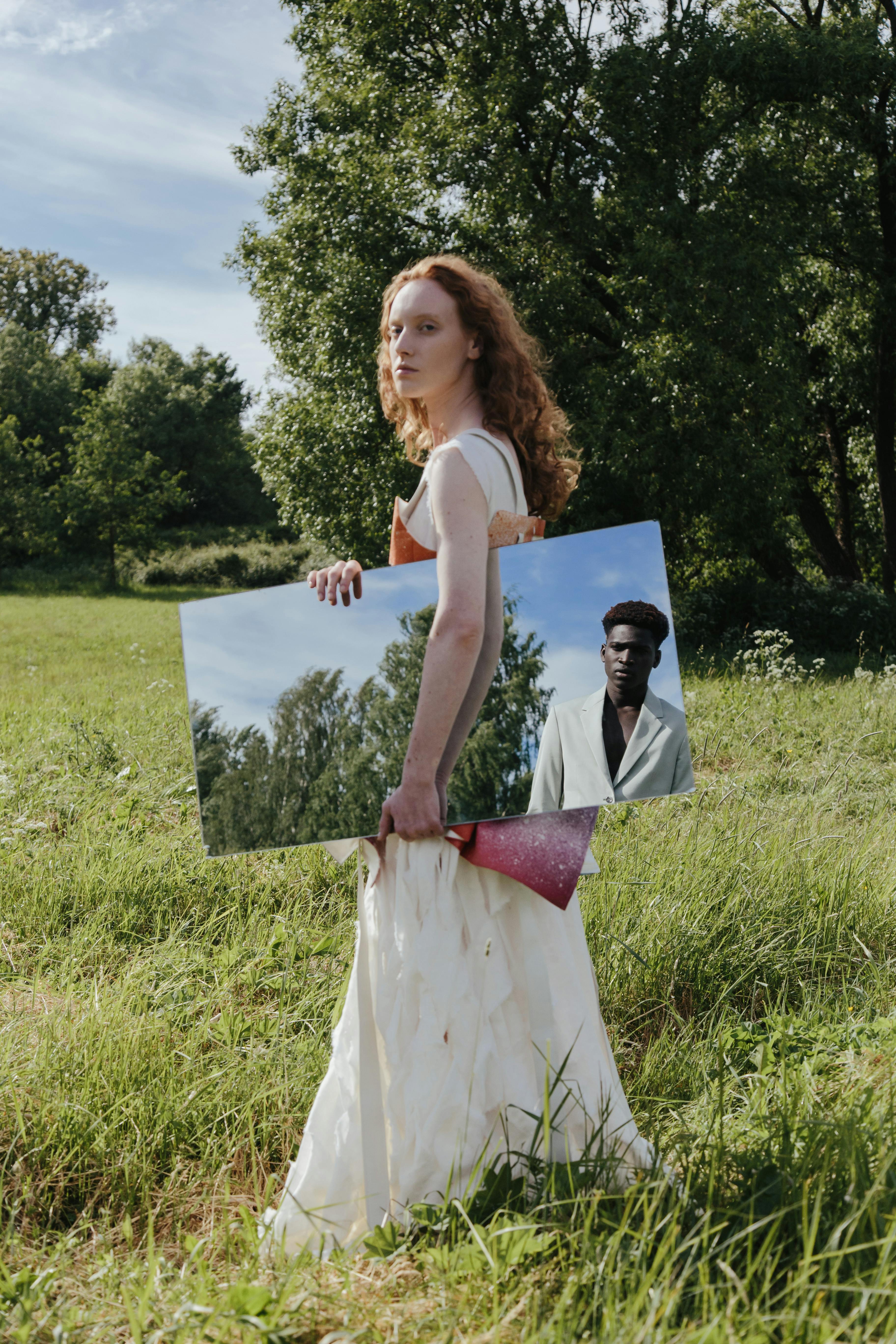 a woman holding a mirror