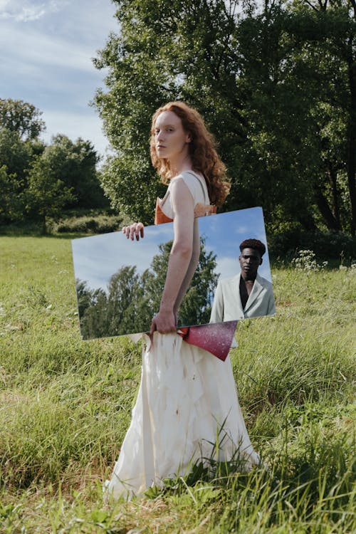 A Woman Holding a Mirror