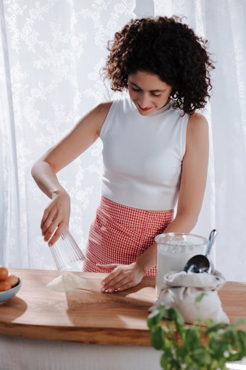 Free Woman Measuring Flour for Italian Pasta Stock Photo
