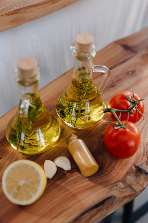 Fresh Tomatoes Lemon Garlic Herbs and Olive Oil for Preparing Italian Cuisine Dish