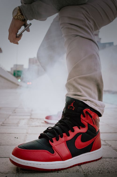 A Close-Up Shot of Man Wearing Air Jordan Sneakers · Free Stock Photo