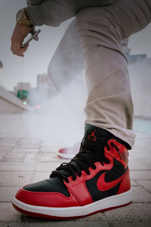 A Close-Up Shot of Man Wearing Air Jordan Sneakers