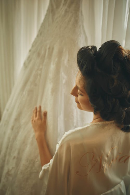 A Woman Touching Her Bridal Dress