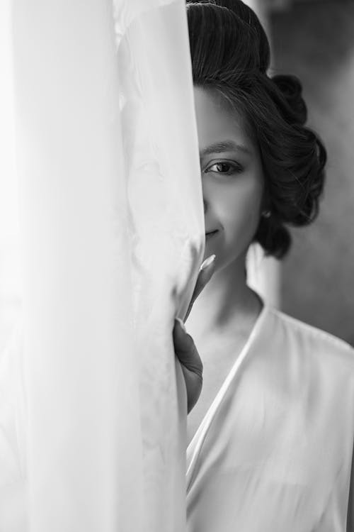 Woman Behind Curtain in Grayscale Photography