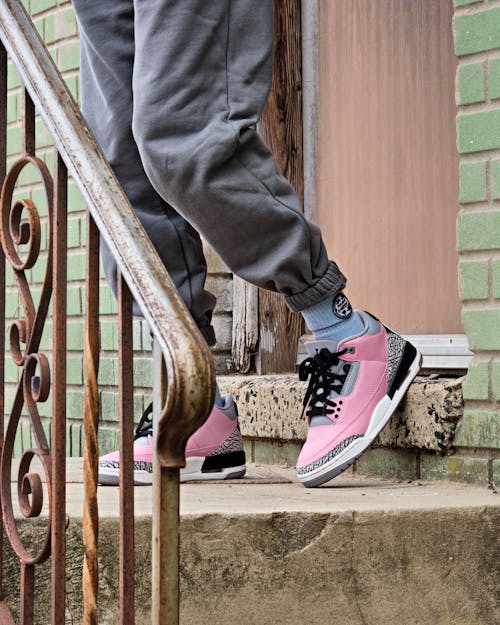 A Person wearing Pink Sneakers