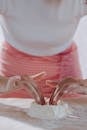 Unrecognizable Female Hands Mixing Flour and Eggs Thoroughly