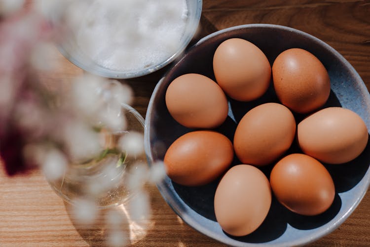 Bowl Full Of Eggs On Kitchen Table