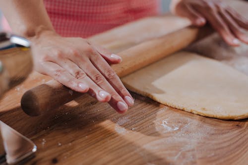 Free Hands Rolling Pasta Dough Stock Photo